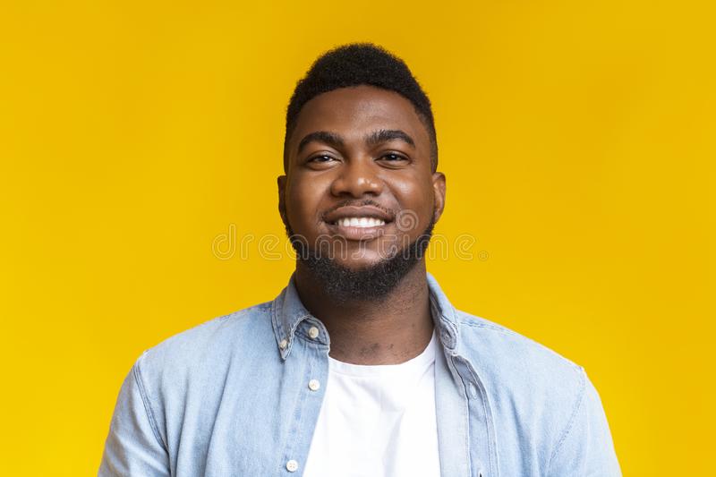 portrait confident black millennial guy over yellow background be yourself closeup copy space 162740248